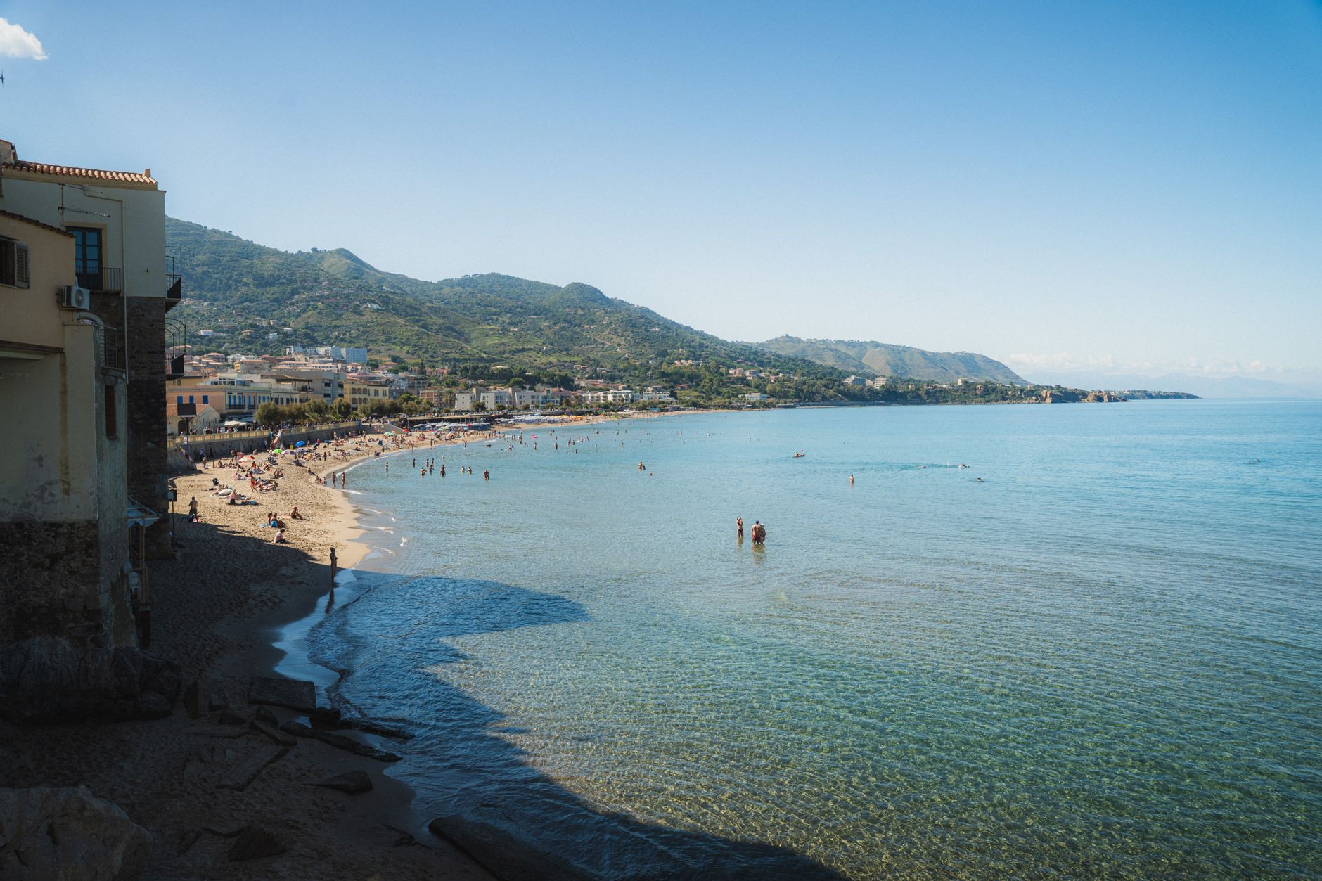 scenic coastal view of beach and mountains