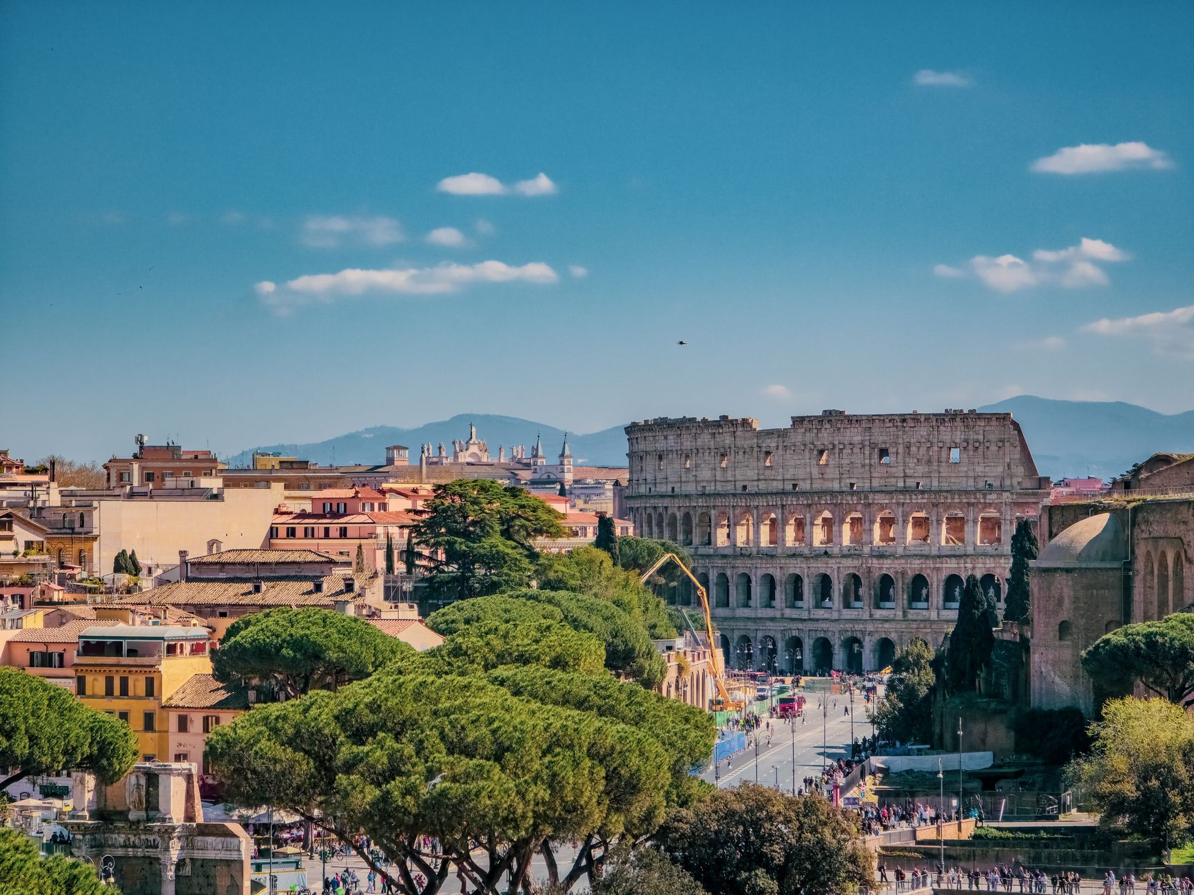 scenic view of rome with colosseum in background